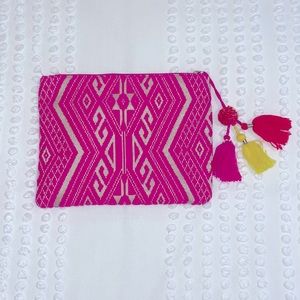 Fun, embroidered clutch with pom poms!